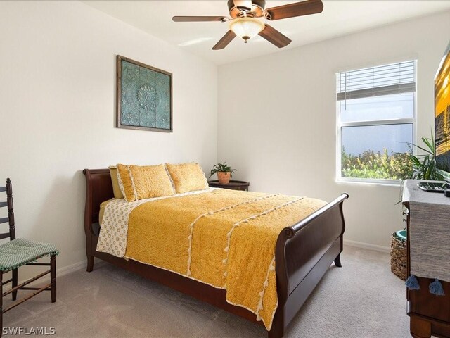 bedroom with ceiling fan and carpet