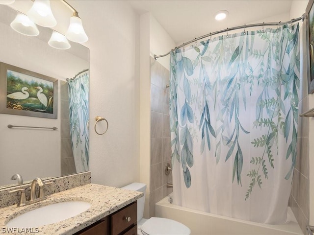 bathroom featuring shower / bath combo, vanity, and toilet