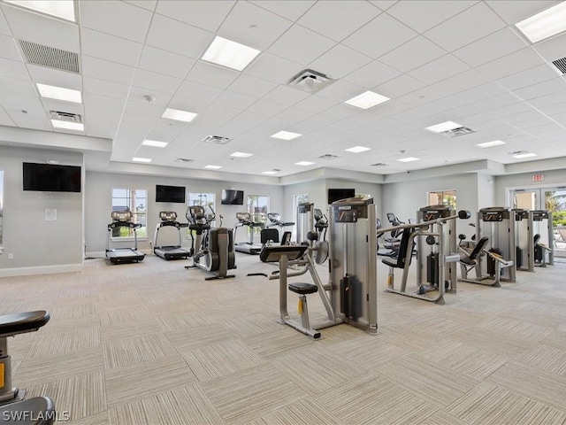 workout area featuring light carpet and visible vents