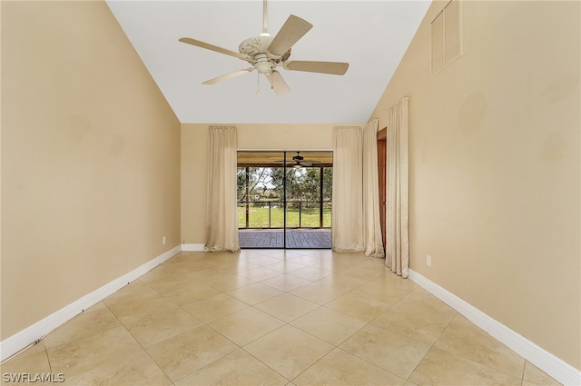 tiled empty room with high vaulted ceiling and ceiling fan