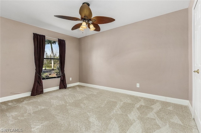 carpeted empty room with ceiling fan