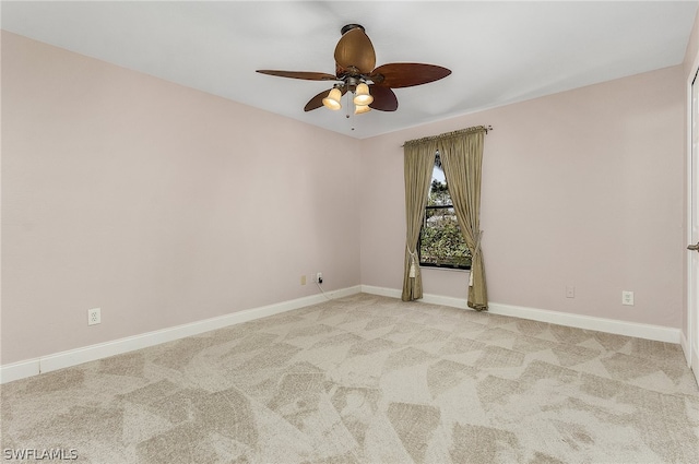 carpeted empty room with ceiling fan