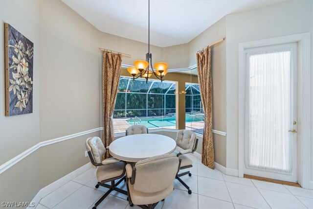 tiled dining space with a wealth of natural light and a chandelier