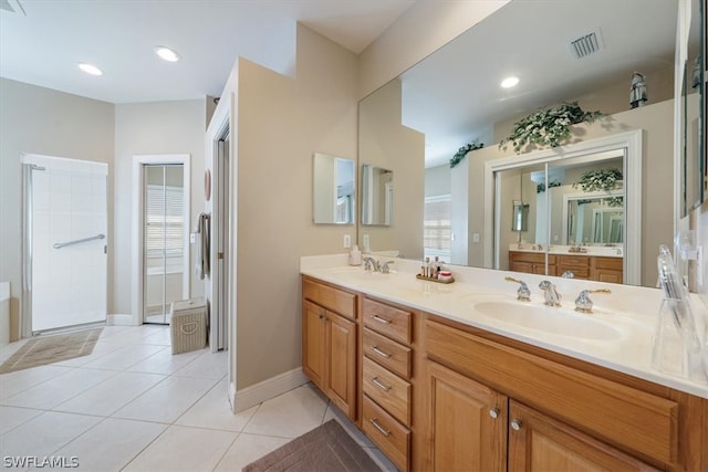 bathroom featuring tile patterned flooring and vanity