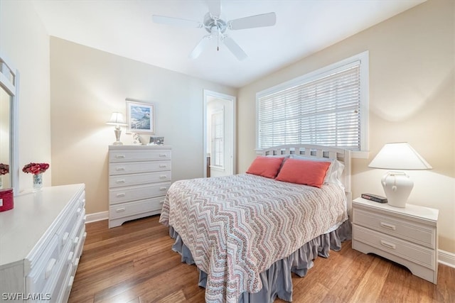 bedroom with light wood-type flooring and ceiling fan