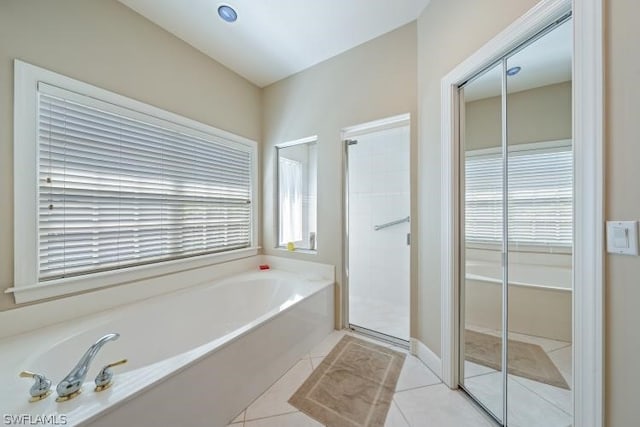 bathroom featuring independent shower and bath and tile patterned floors