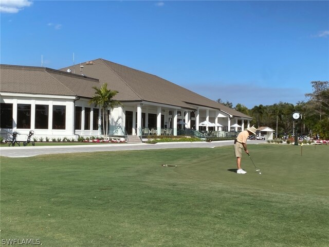 view of home's community featuring a lawn