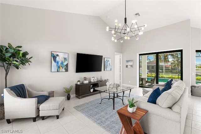 living room featuring light tile floors, high vaulted ceiling, and a notable chandelier