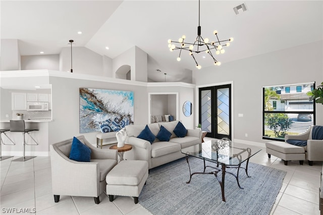 living room with french doors, high vaulted ceiling, a notable chandelier, and light tile flooring