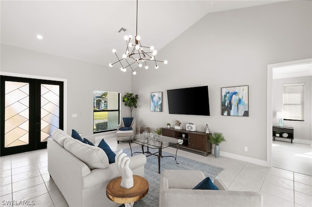 living room featuring high vaulted ceiling, french doors, light tile flooring, and a chandelier