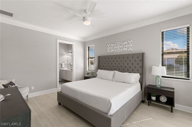 bedroom with ceiling fan, multiple windows, connected bathroom, crown molding, and light hardwood / wood-style flooring