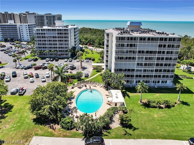 birds eye view of property with a water view