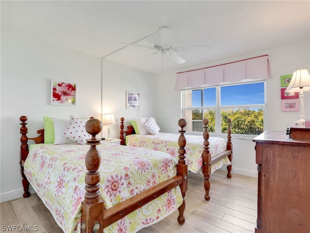 bedroom featuring light hardwood / wood-style floors and ceiling fan