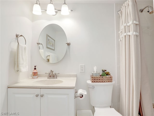 bathroom with toilet and vanity