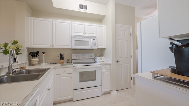14541 Legends Blvd N Unit 206, Fort Myers, FL 33912 - kitchen featuring sink, light tile patterned floors, white cabinets, and white appliances