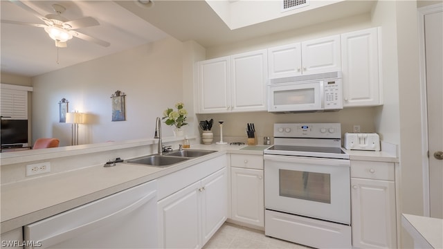 14541 Legends Blvd N Unit 206, Fort Myers, FL 33912 - kitchen featuring white cabinetry, sink, ceiling fan, and white appliances