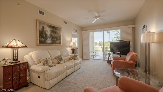 14541 Legends Blvd N Unit 206, Fort Myers, FL 33912 - living room with light carpet and ceiling fan