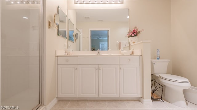 14541 Legends Blvd N Unit 206, Fort Myers, FL 33912 - bathroom featuring a shower with door, vanity, tile patterned floors, and toilet