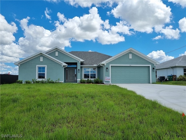 view of front of house with a garage and a front yard