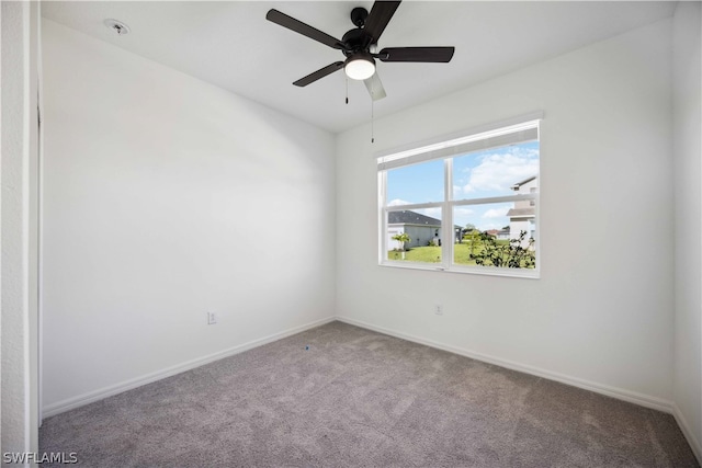 carpeted empty room with ceiling fan