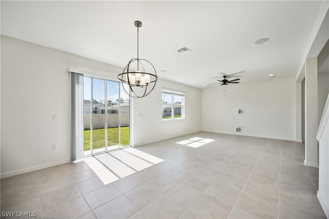 unfurnished dining area with light tile patterned floors and ceiling fan with notable chandelier