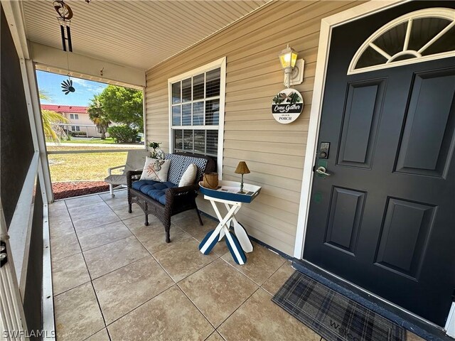 doorway to property with covered porch