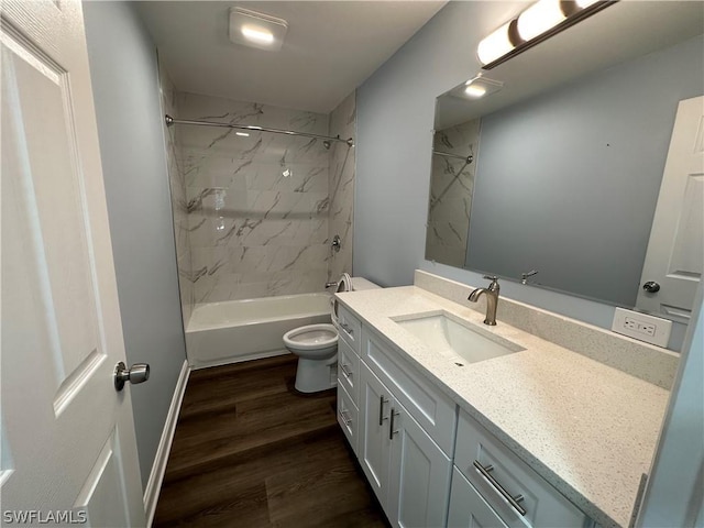 bathroom with toilet,  shower combination, wood finished floors, and vanity