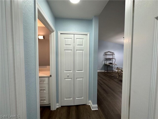 corridor featuring dark hardwood / wood-style flooring