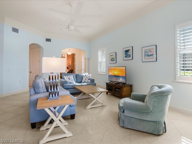 tiled living room featuring crown molding and ceiling fan