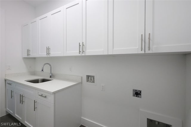 laundry room featuring washer hookup, cabinets, electric dryer hookup, and sink