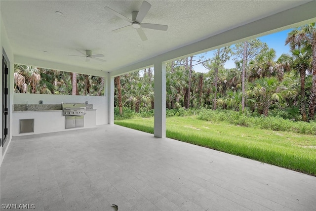 view of patio featuring a grill, area for grilling, and ceiling fan