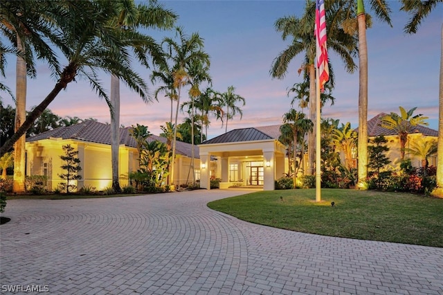 view of front of property with a lawn