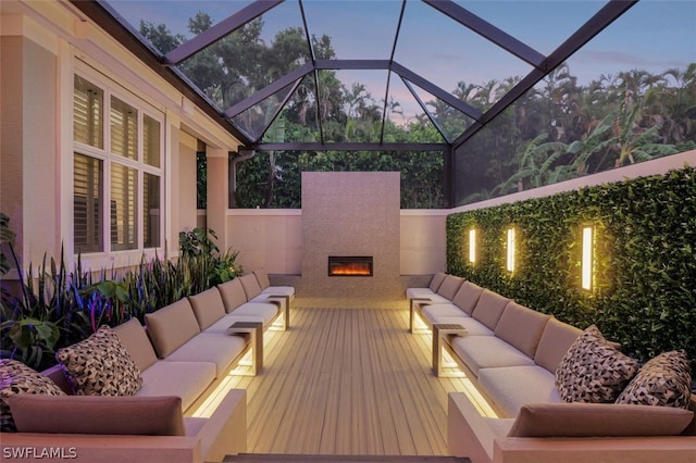 sunroom with an outdoor fireplace