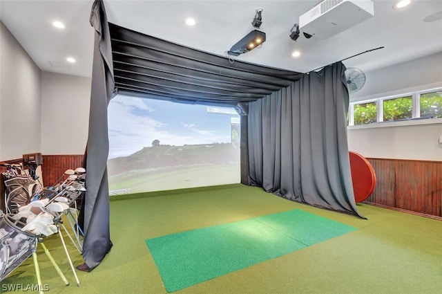 playroom with carpet floors and golf simulator