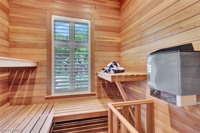 view of sauna featuring wood walls