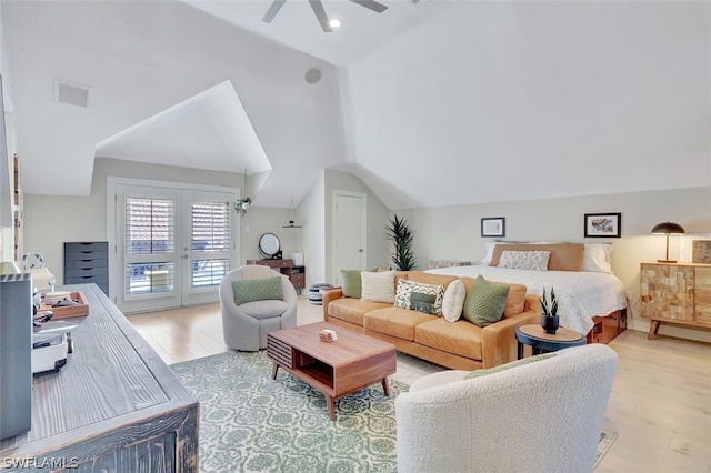 bedroom with vaulted ceiling, ceiling fan, access to outside, and light hardwood / wood-style flooring