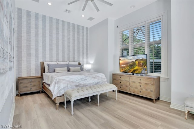 bedroom featuring ceiling fan and light hardwood / wood-style floors