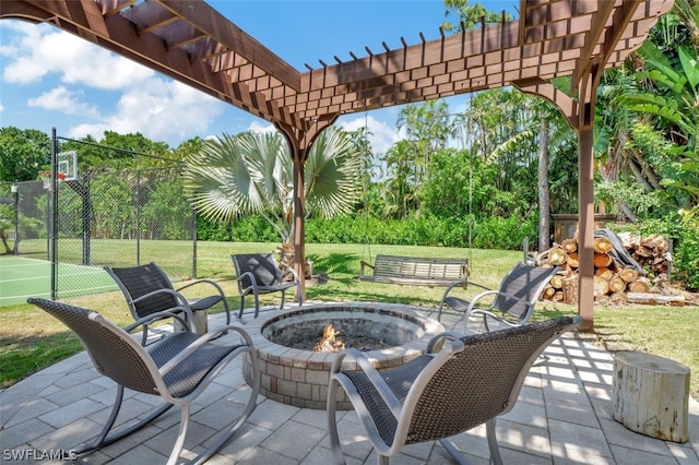 view of patio featuring a pergola and an outdoor fire pit