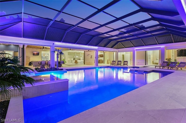 view of swimming pool with a lanai and a patio area