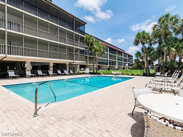 view of swimming pool with a patio area