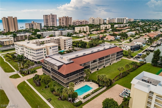 birds eye view of property with a water view