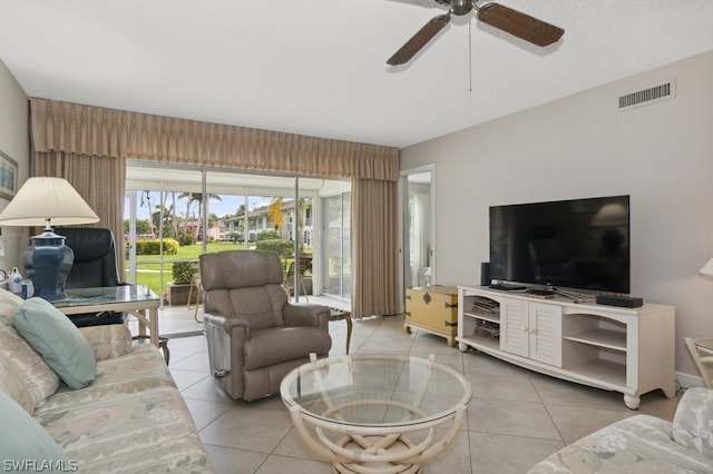 living room featuring ceiling fan and light tile patterned floors