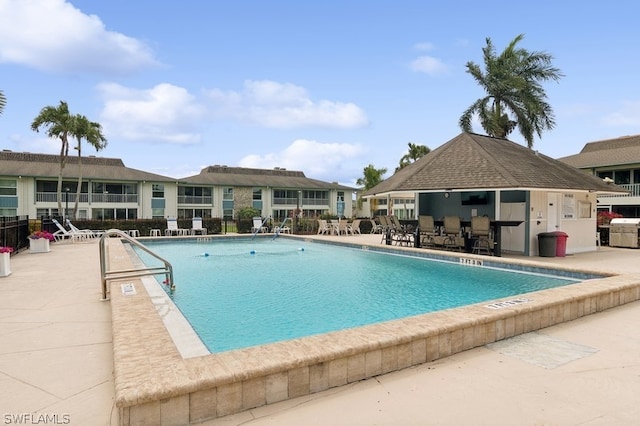 view of swimming pool with a patio area