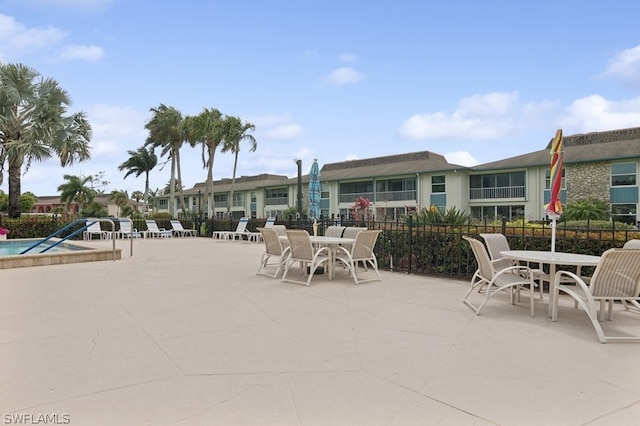 view of patio featuring a community pool