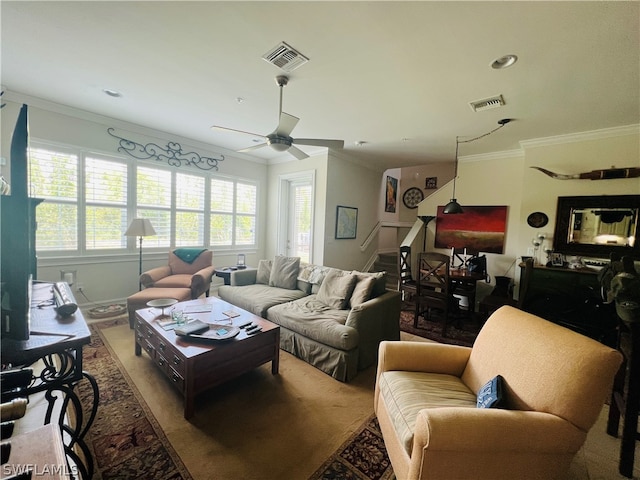 living room with ceiling fan, crown molding, and a wealth of natural light