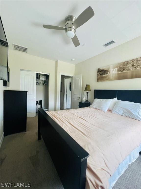 carpeted bedroom with ceiling fan, a closet, and visible vents