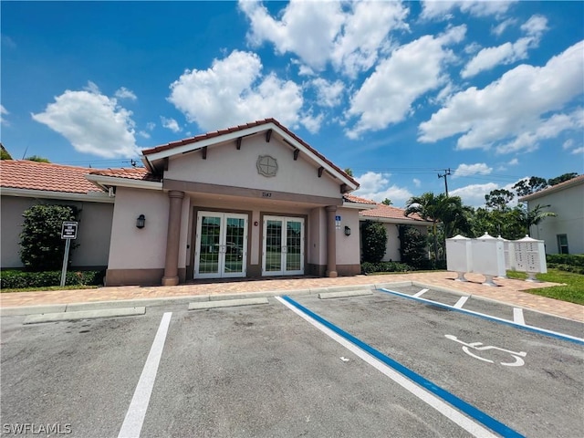 view of building exterior featuring uncovered parking