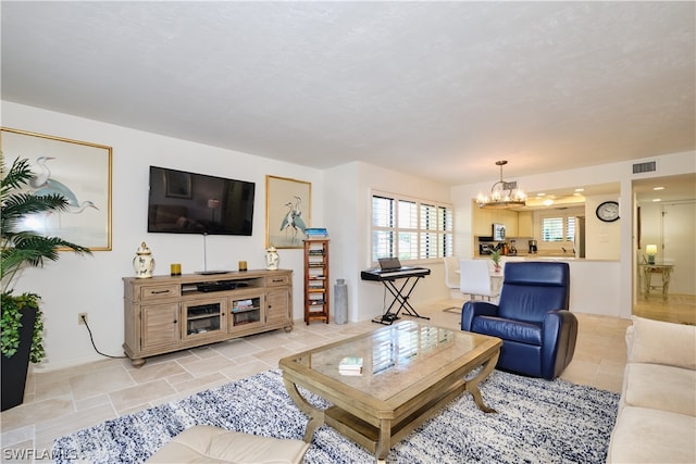 living room with a notable chandelier