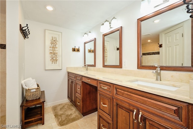 bathroom featuring tile patterned flooring and vanity