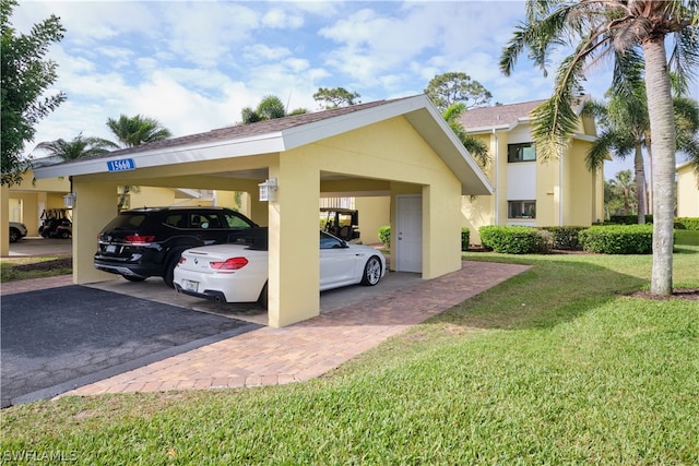 view of car parking featuring a yard and a carport